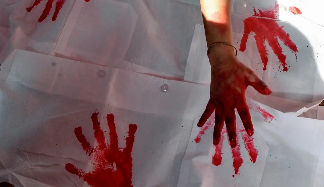 People print their hand impression on a cloth during the Junior Doctors fast-unto-death hunger strike demanding justice for the victim of the RG Kar Hospital rape-murder case, in Kolkata.