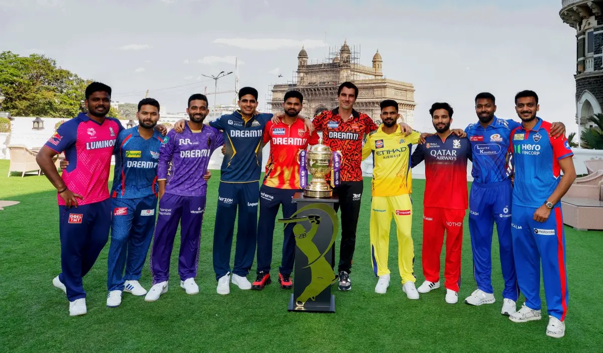 From L-R: Rajasthan Royals captain Sanju Samson, Lucknow Super Giants captain Rishabh Pant, Kolkata Knight Riders captain Ajinkya Rahane, Gujarat Titans captain Shubman Gill, Punjab Kings captain Shreyas Iyer, Sunrisers Hyderabad captain Pat Cummins, Chennai Super Kings captain Ruturaj Gaikwad, Royal Challengers Bengaluru captain Rajat Patidar, Mumbai Indians captain Hardik Pandya and Delhi Capitals captain Axar Patel pose for a photograph with trophy ahead of the IPL 2025 | Photo: X / IPL