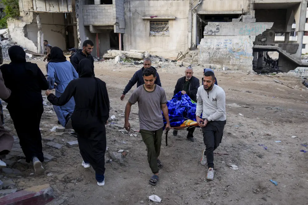 The body of a Palestinian killed in an Israeli army airstrikes is brought to Shifa Hospital in Gaza City | AP