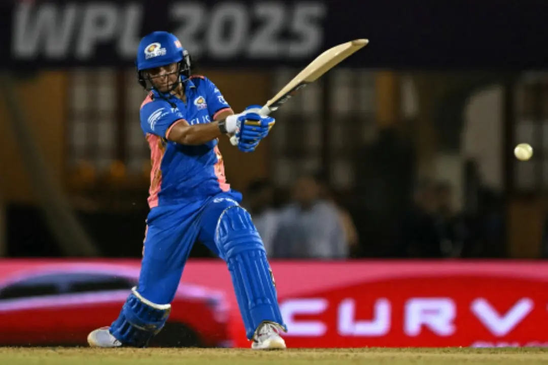 Mumbai Indians' captain Harmanpreet Kaur plays a shot during the Women's Premier League (WPL) Twenty20 final cricket match between Mumbai Indians and Delhi Capitals at Brabourne Stadium in Mumbai. | Photo: AFP
