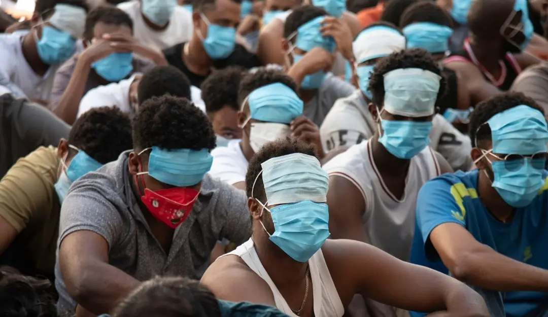 People trafficked and forced to work in scam centers, sit with their faces masked while in detention after being released from the centers in Myawaddy district in eastern Myanmar. | File image: AP