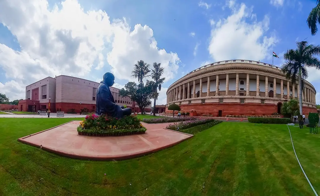 The existing Parliament building and the new complex (L) on the first day of the special session of Parliament | Photo: PTI