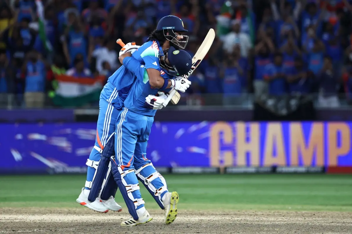 KL Rahul (L) and Ravindra Jadeja celebrate their victory at the end of the ICC Champions Trophy one-day international (ODI) final cricket match between India and New Zealand at the Dubai International Stadium | Photo: AFP