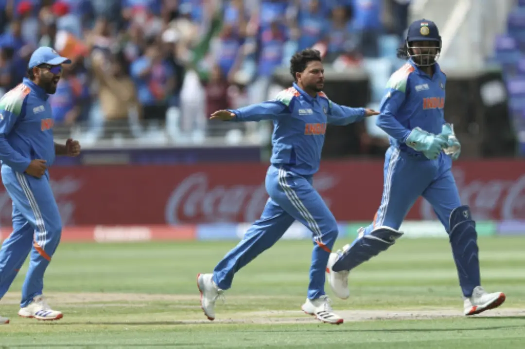Kuldeep Yadav, center, celebrates the dismissal of New Zealand's Rachin Ravindra during the ICC Champions Trophy final cricket match between India and New Zealand at Dubai International Cricket Stadium in Dubai. | Photo: AP