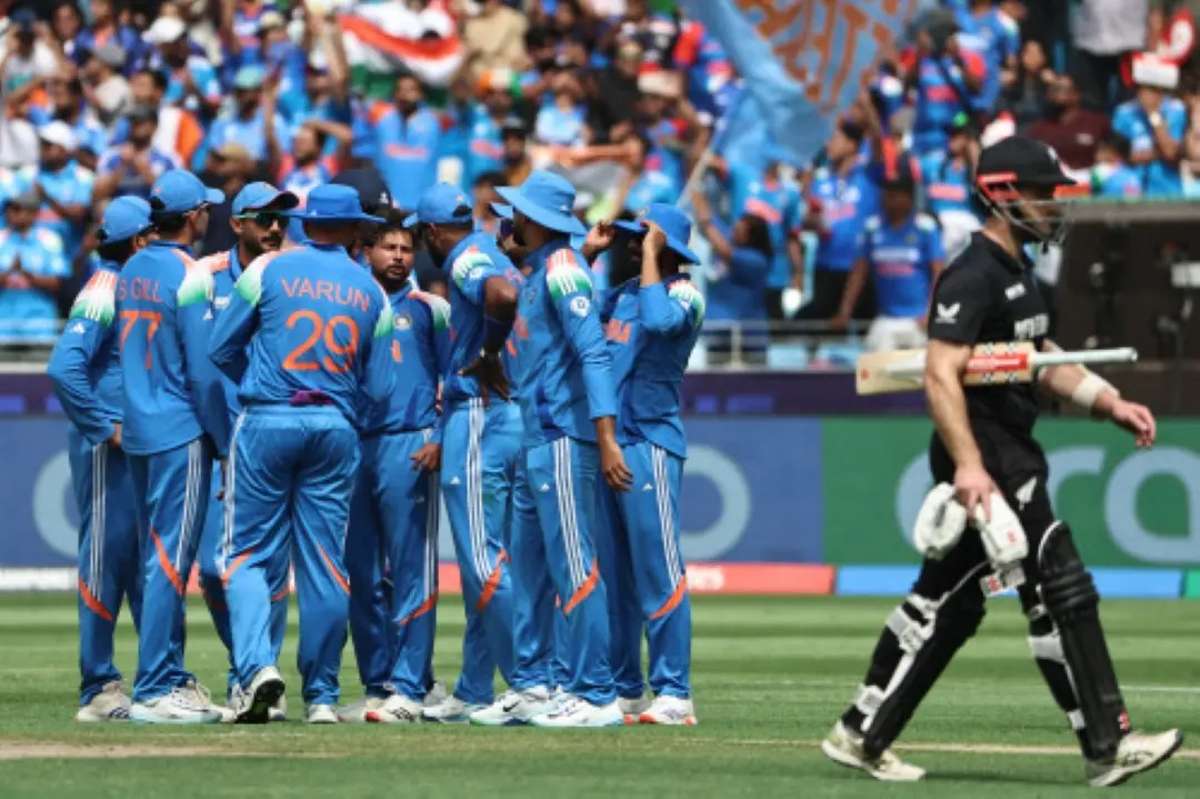 India's Kuldeep Yadav (C) celebrates with teammates after taking the wicket of New Zealand's Kane Williamson (R) during the ICC Champions Trophy one-day international (ODI) final cricket match between India and New Zealand at the Dubai International Stadium in Dubai. | Photo: AFP