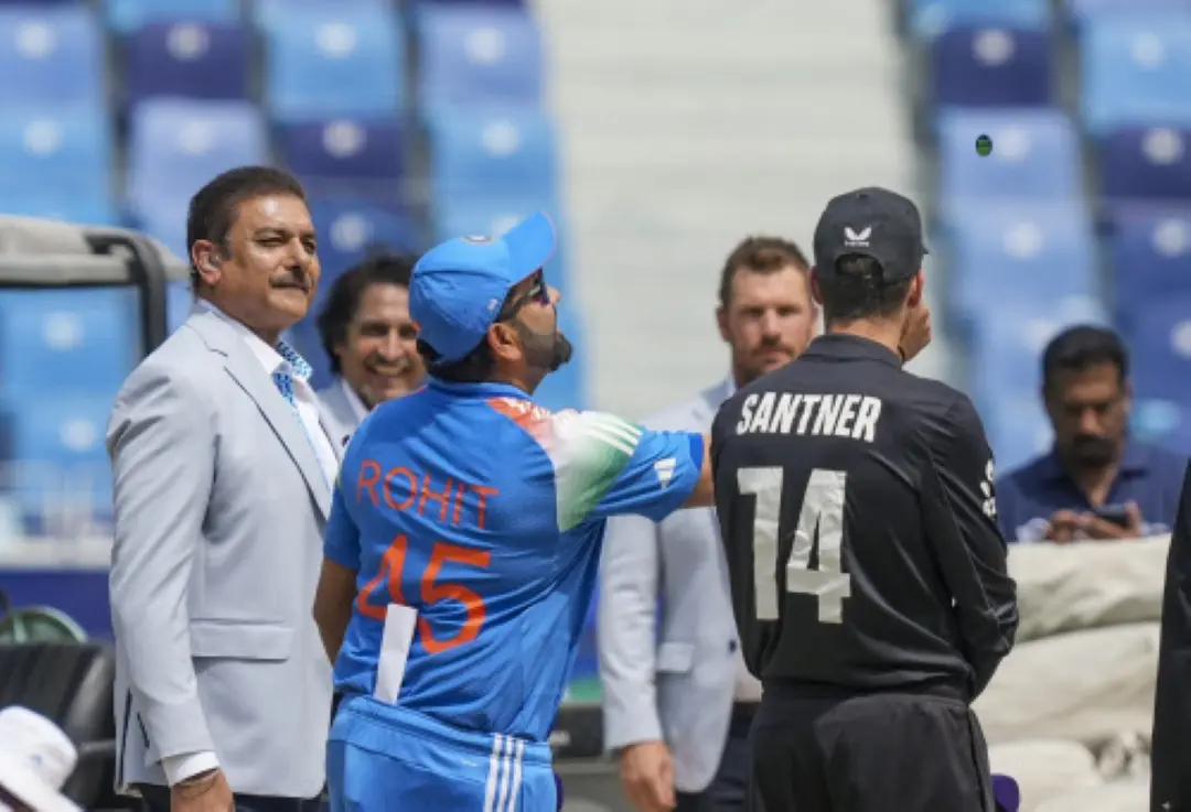 India's captain Rohit Sharma and New Zealand's captain Mitchell Santner at the toss before the start of the ICC Champions Trophy 2025 final cricket match between India and New Zealand, in Dubai. | Photo: PTI