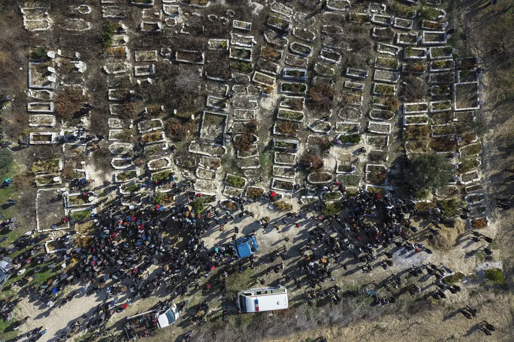 Relatives and neighbours attend the funeral procession for four Syrian security force members killed in clashes with loyalists of ousted President Bashar Assad | AP