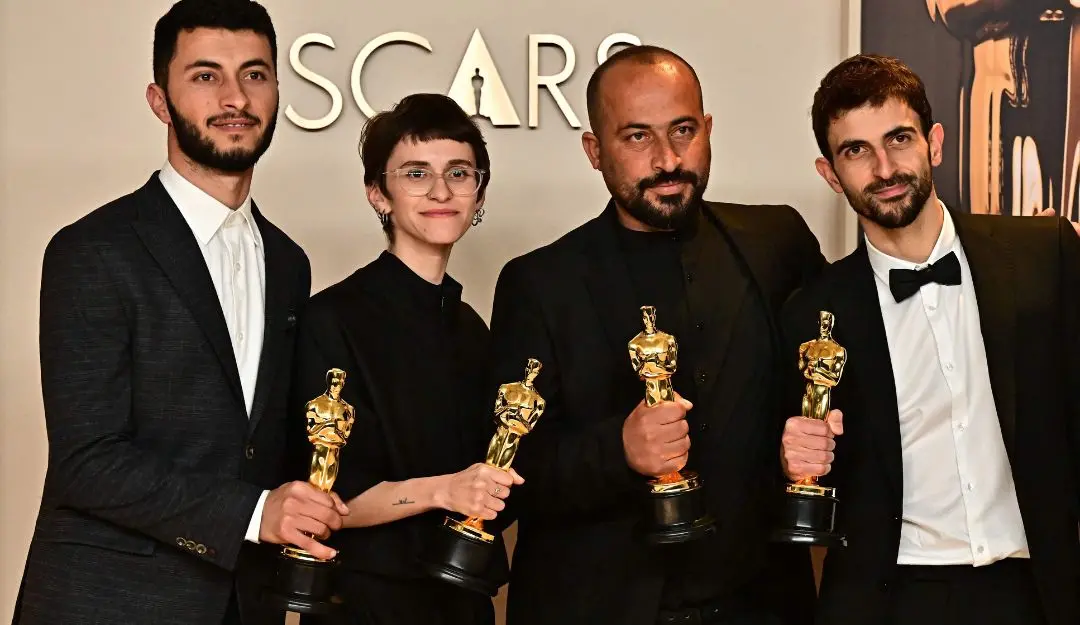 (Left to Right) Israeli journalist and filmmaker Yuval Abraham, US producer Rachel Szor, Emirati filmmaker Hamdan Ballal, Palestinian journalist and filmmaker Basel Adra pose in the press room with the Oscar for Best Documentary Feature for 'No Other Land' during the 97th Annual Academy Awards at the Dolby Theatre in Hollywood.