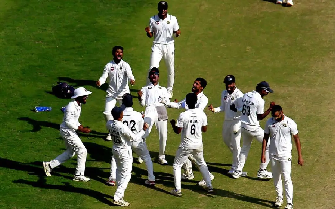 Kerala team celebrates after taking the last wicket of Gujarat to take a first innings lead of two runs in the semi final match at Ahmedabad