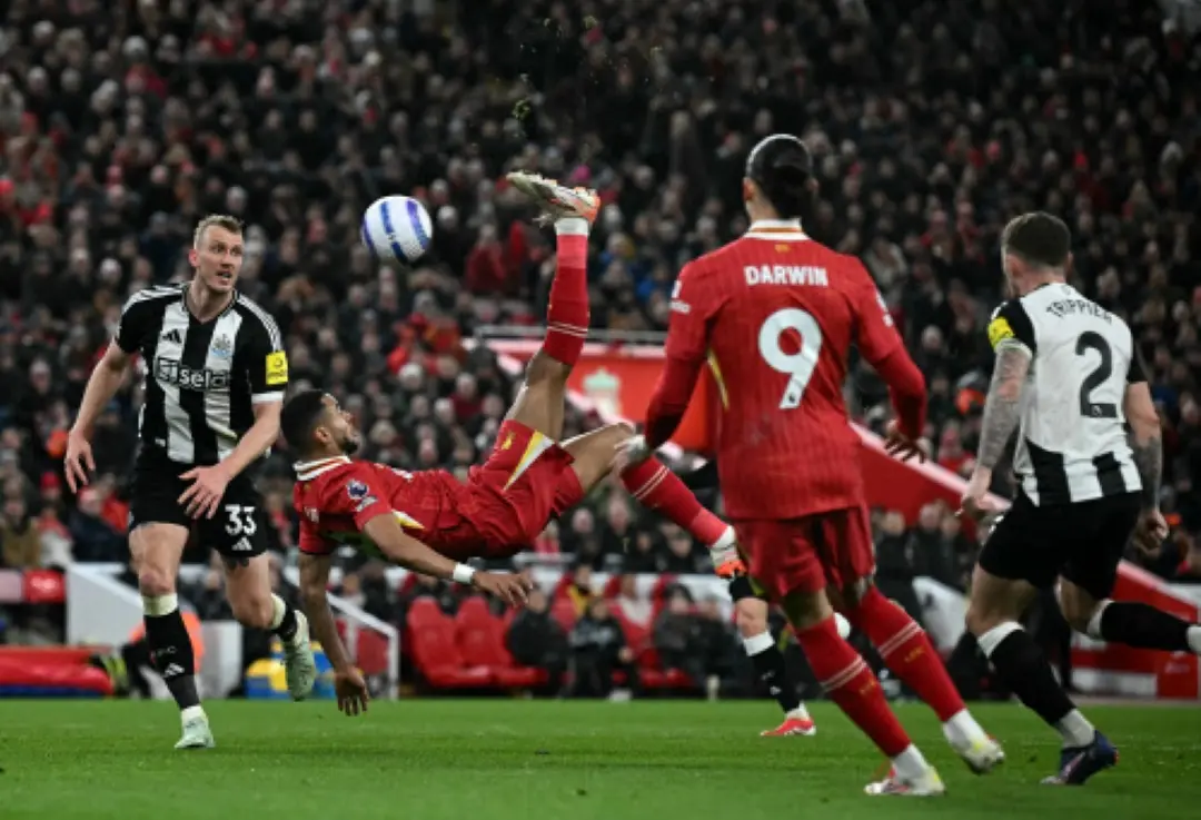 Liverpool's Dutch striker #18 Cody Gakpo attempts an overhead bicycle kick during the English Premier League football match between Liverpool and Newcastle United at Anfield in Liverpool, north west England. | Photo: AFP