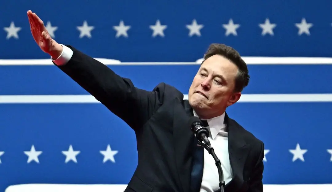 Tesla and SpaceX CEO Elon Musk gestures as he speaks during Trump's inaugural parade (Photo: AFP)