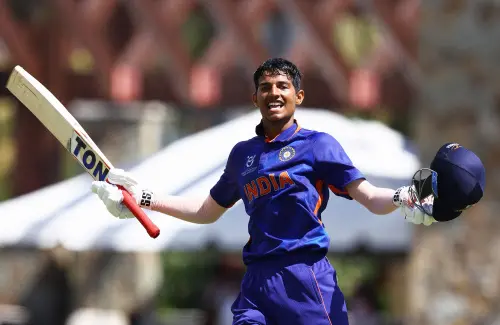 Yash Dhull celebrates after scoring a century I  PTI