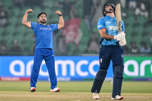 Afghanistan's Gulbadin Naib  celebrates after taking the wicket of England's Liam Livingstone  during the ICC Champions Trophy one-day international (ODI) cricket match between England and Afghanistan at the Gaddafi Stadium in Lahore on February 26, 2025. | Photo: AFP