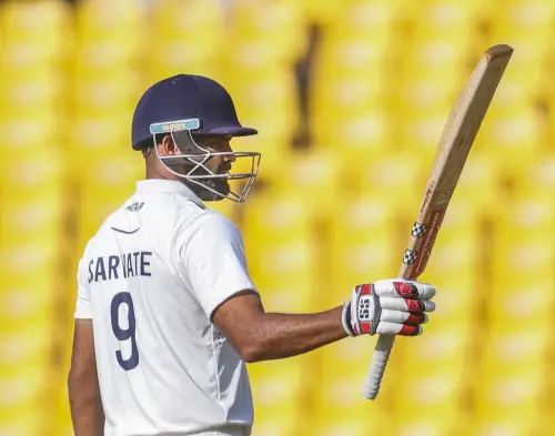 Kerala's Aditya Sarwate celebrates his half century on the second day of the Ranji Trophy final cricket match between Vidarbha and Kerala, at Vidarbha Cricket Association (VCA) Stadium, in Nagpur, Thursday Feb. 27, 2025. | Photo: PTI