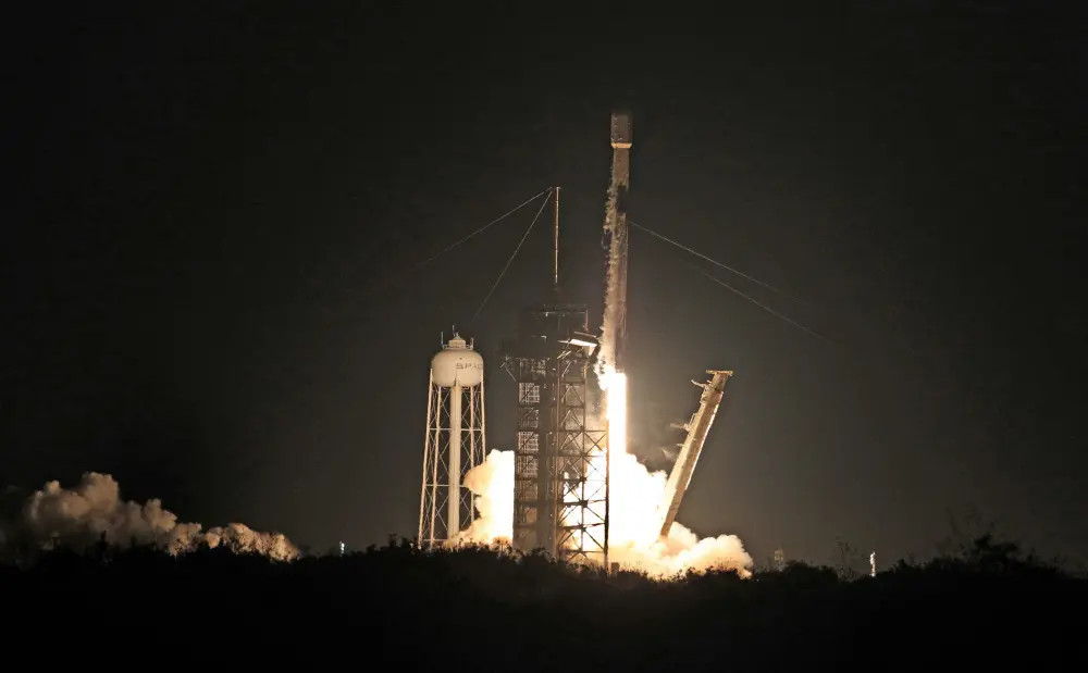 Intuitive Machines' Athena lander on top of a SpaceX Falcon 9 rocket, lifts off from Launch Complex 39A at NASA's Kennedy Space Center | AFP