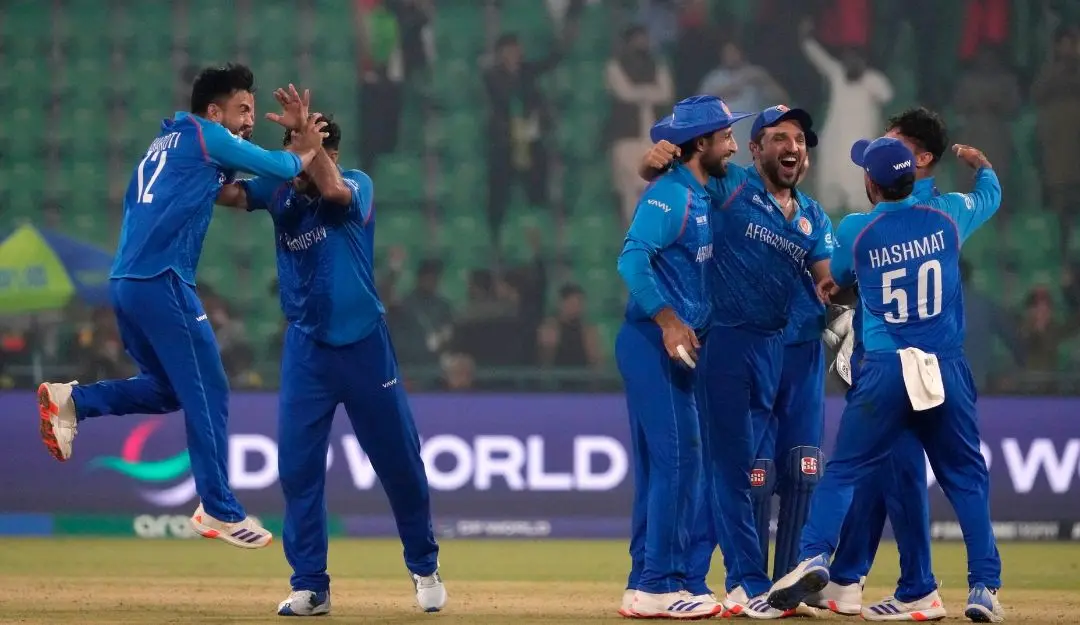 Afghanistan's Azmatullah Omarzai and teammates celebrate after winning the ICC Champions Trophy cricket match against England | Photo: AP