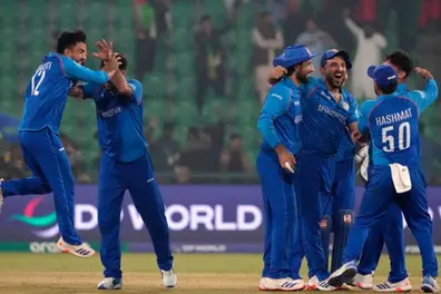 Afghanistan beat England by eight runs to knock them out of the Champions Trophy