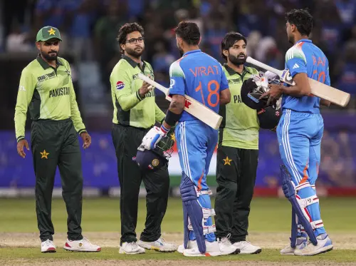 India's Virat Kohli, center and Axar Patel, right, being congratulated by Pakistan's captain Mohammed Rizwan, (second right), Imam-ul-Haq, (second left), and Babar Azam after winning the One Day International (ODI) cricket match of the ICC Champions Trophy against Pakistan, at Dubai International Cricket Stadium, in Dubai, UAE, Sunday, Feb. 23, 2025. | Photo: PTI