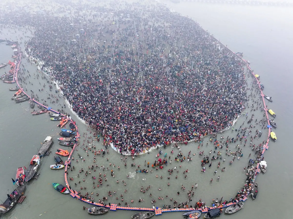 Devotees take a dip at Triveni Sangam | Photo: ANI