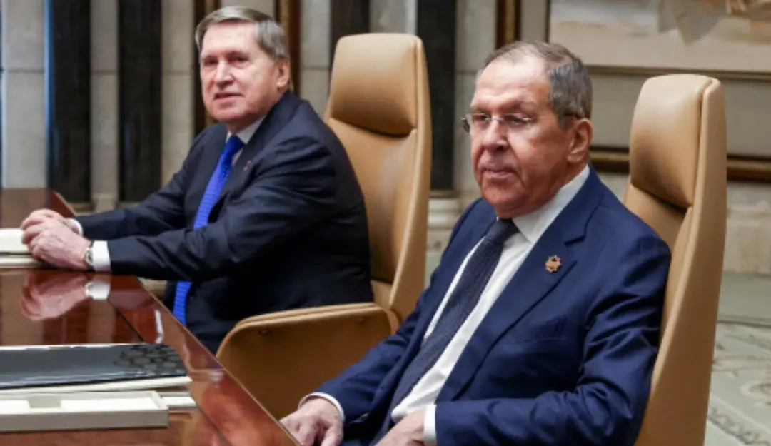 The Russian president's foreign policy advisor Yuri Ushakov and Russia's Foreign Minister Sergei Lavrov attend a meeting with the US