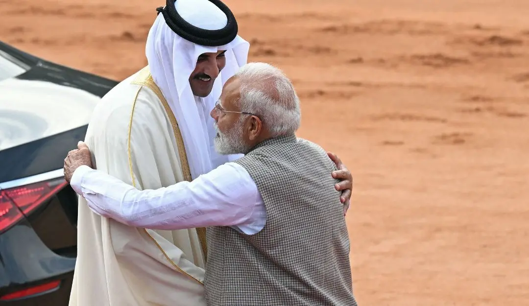 Qatar's Emir Sheikh Tamim bin Hamad Al-Thani (L) is greeted by PM Modi during the emir's ceremonial reception at India's presidential palace Rashtrapati Bhavan in New Delhi | Photo: AFP