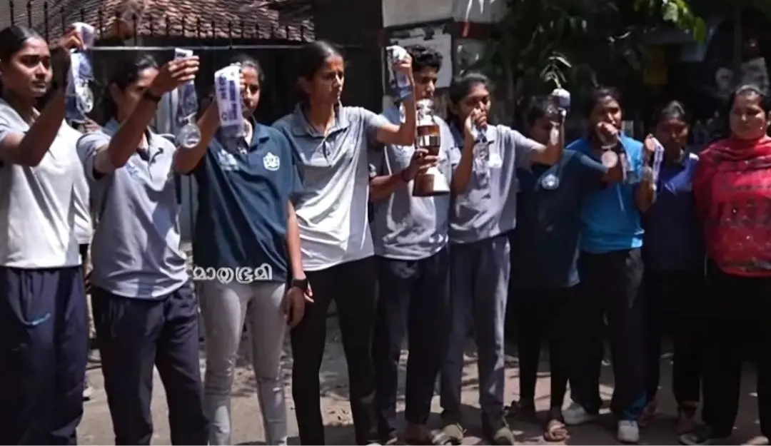 Kerala Women's Beach Handball team protesting against Sports Miinister V Abdurahiman over his controversial 'match-fixing' remark outside the Sports Council office.