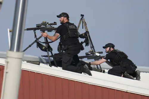 Police snipers return fire after shots were fired while Republican presidential candidate former President Donald Trump