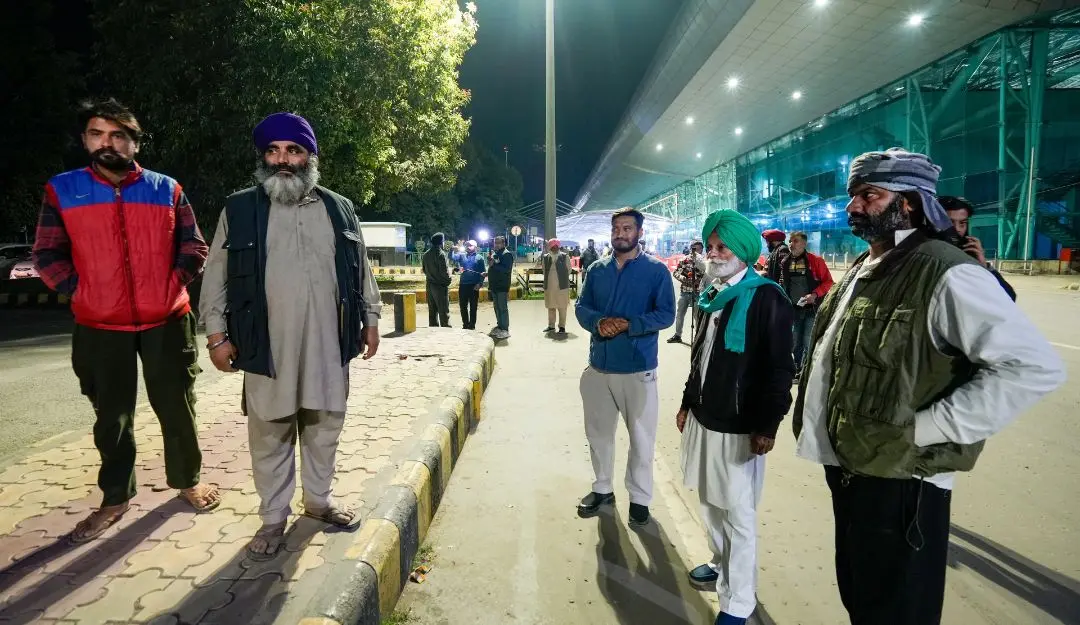 Relatives wait outside the airport ahead of the second batch of the immigrants' arrival from the US in Amritsar | Photo: PTI