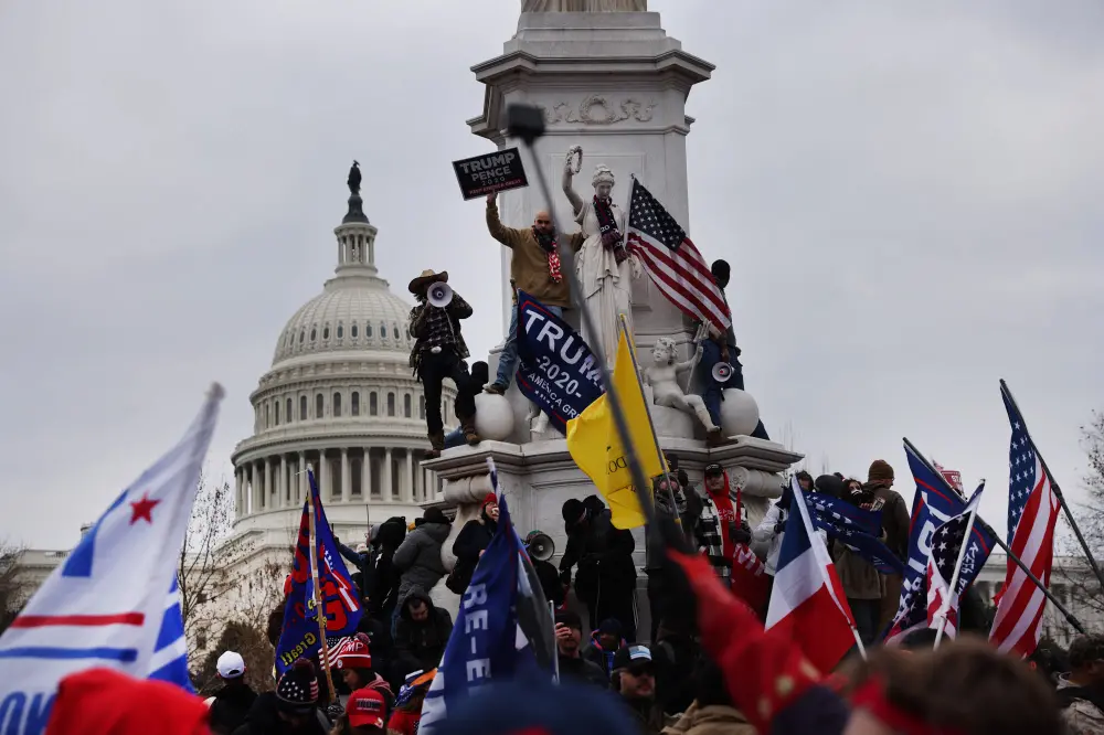 Trump, who earlier encouraged his supporters to head to the Capitol, urged them to abide by the law and go back home after the violent clash. | AFP