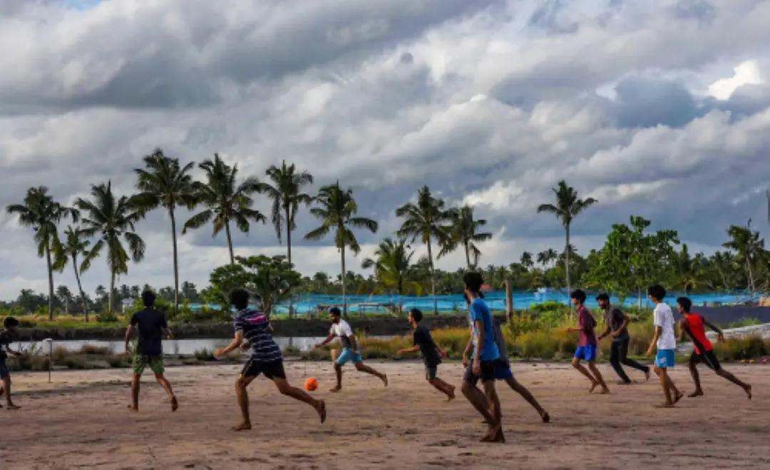 Boys play football in a field in Kerala | File Photo: PTI
