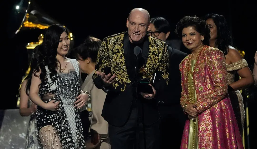 Eru Matsumoto, Wouter Kellerman, and Chandrika Tandon accept the award for best new age, ambient, or chant album for 'Triveni' | Photo: AP