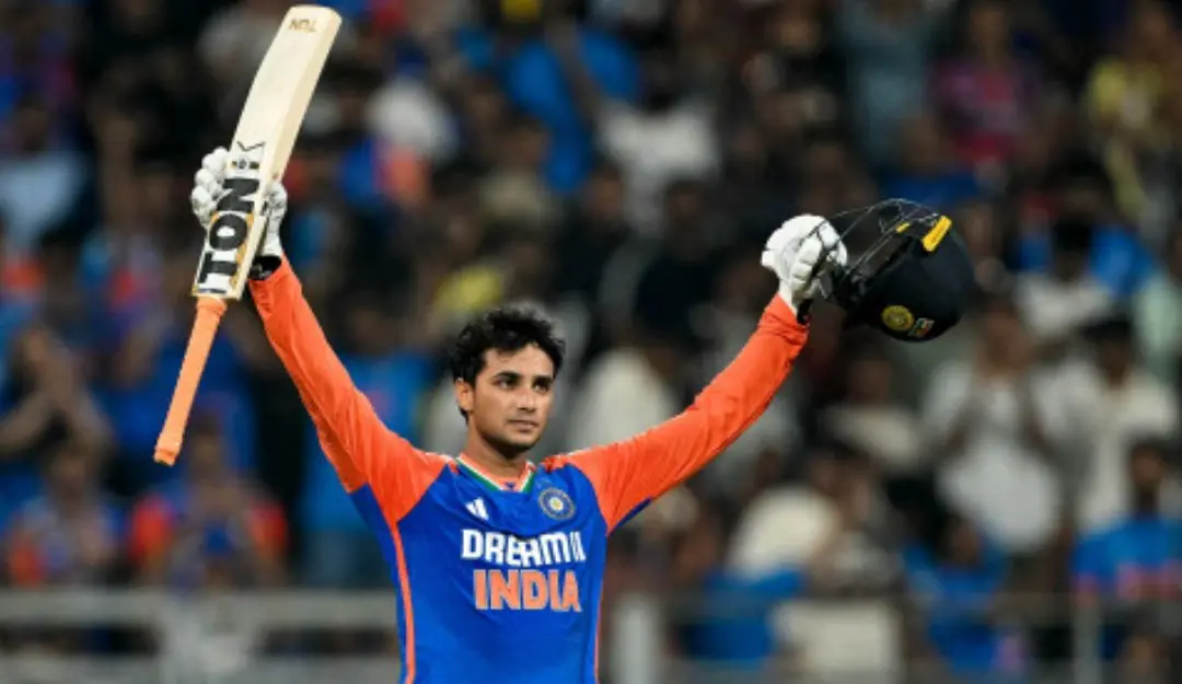 India's Abhishek Sharma celebrates after scoring a century (100 runs) during the fifth and final Twenty20 international cricket match between India and England at the Wankhede Stadium in Mumbai. | Photo: AFP