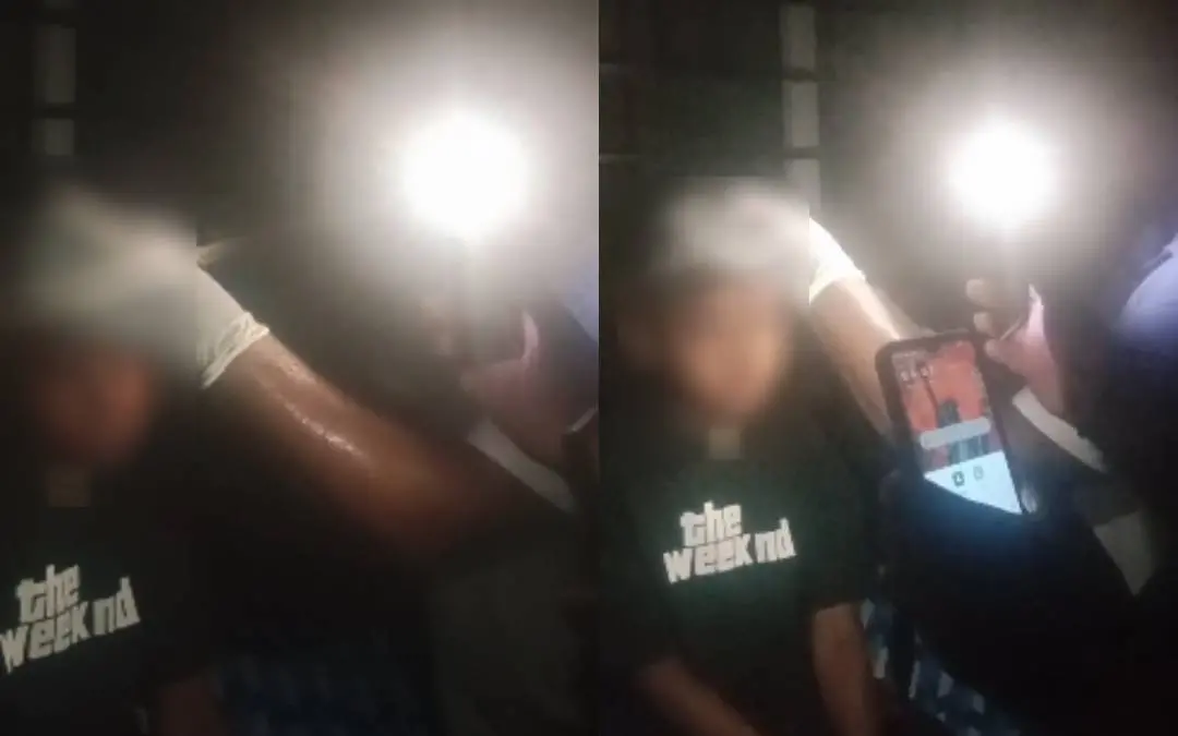 The child receiving sutures under mobile phone light