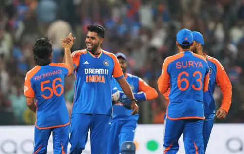 Indian bowler Harshit Rana with teammates celebrates the wicket of England batter Jamie Overton during the fourth T20 cricket match between India and England, at Maharashtra Cricket Association Stadium, in Pune. | Photo: PTI