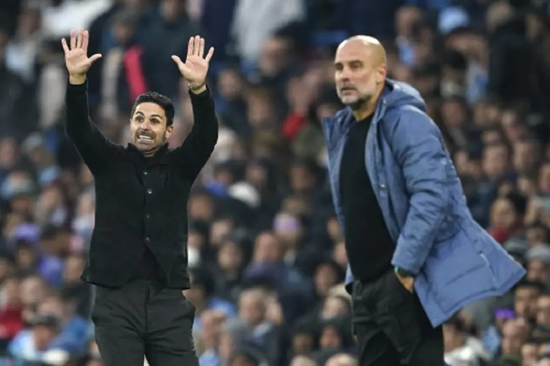 Arsenal's manager Mikel Arteta, left, gestures as he stands on the touchline next to Manchester City's head coach Pep Guardiola during the English Premier League soccer match between Manchester City and Arsenal at the Etihad stadium in Manchester, England (file pic) . | Photo: AP