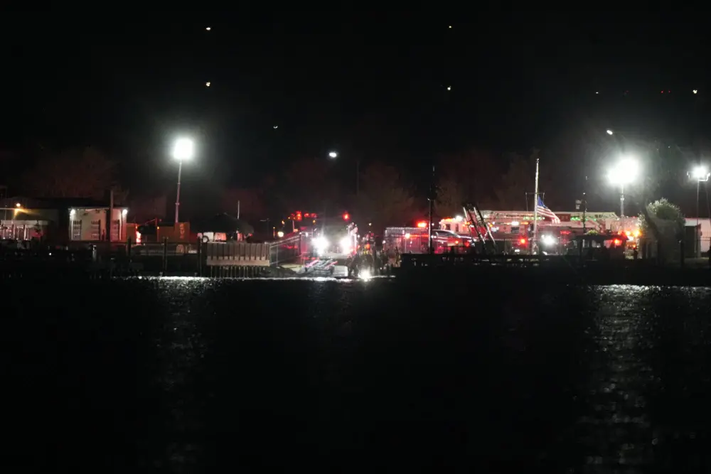 A view of emergency response looking from Arlington, Va., south of Ronald Reagan Washington National Airport, across the Potomac River toward the District of Columbia | AP