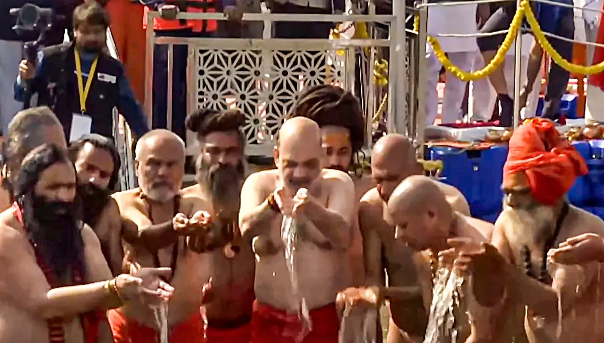 Amit Shah takes a holy dip during Mahakumbh