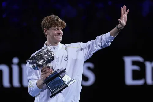 Jannik Sinner of Italy waves as he carries the Norman Brookes Challenge Cup after defeating Alexander Zverev of Germany in the men's singles final at the Australian Open tennis championship in Melbourne, Australia. | Photo: AP