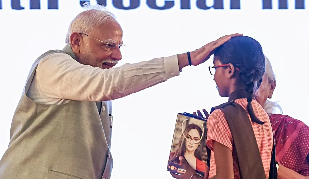 Prime Minister Narendra Modi gives blessings to a girl