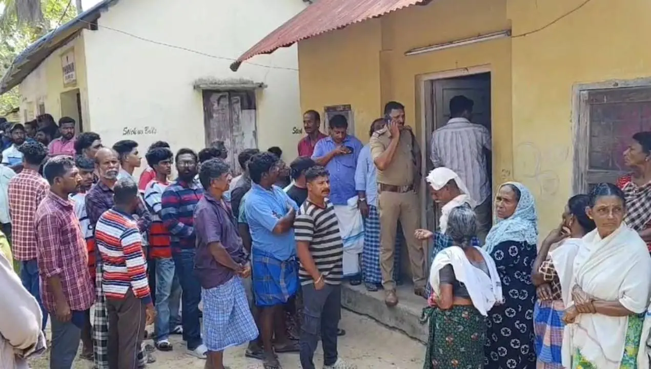 Crowd outside the house where a woman was found dead with stab wounds in Thiruvananthapuram