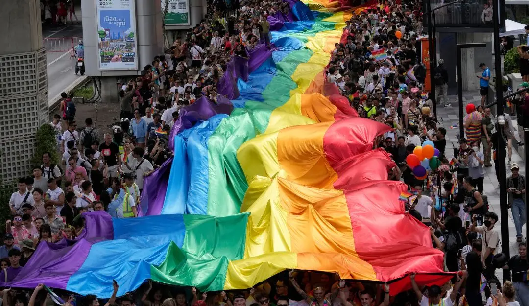 Participants hold a rainbow flag during the Pride Parade in Bangkok, Thailand (Photo: AP)