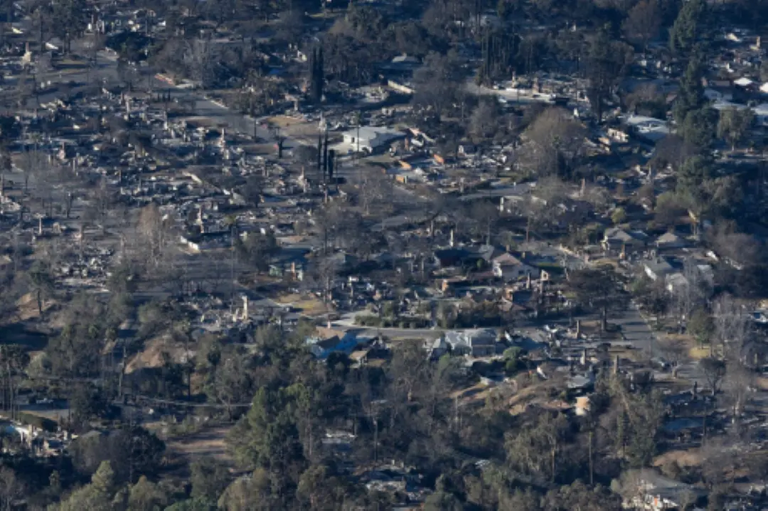 Structures damaged from the Eaton Fire in Altadena as wildfires cause damage and loss through the LA region. Multiple wildfires fueled by intense Santa Ana Winds are burning across Los Angeles County, with some containment achieved by fire crews. | Photo: AFP