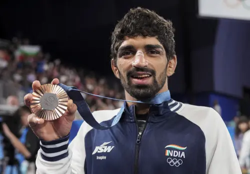 Bronze medalist India's Aman Sehrawat poses for photos during the victory ceremony for the men's 57kg free-style wrestling event at the 2024 Summer Olympics, in Paris | Photo: PTI