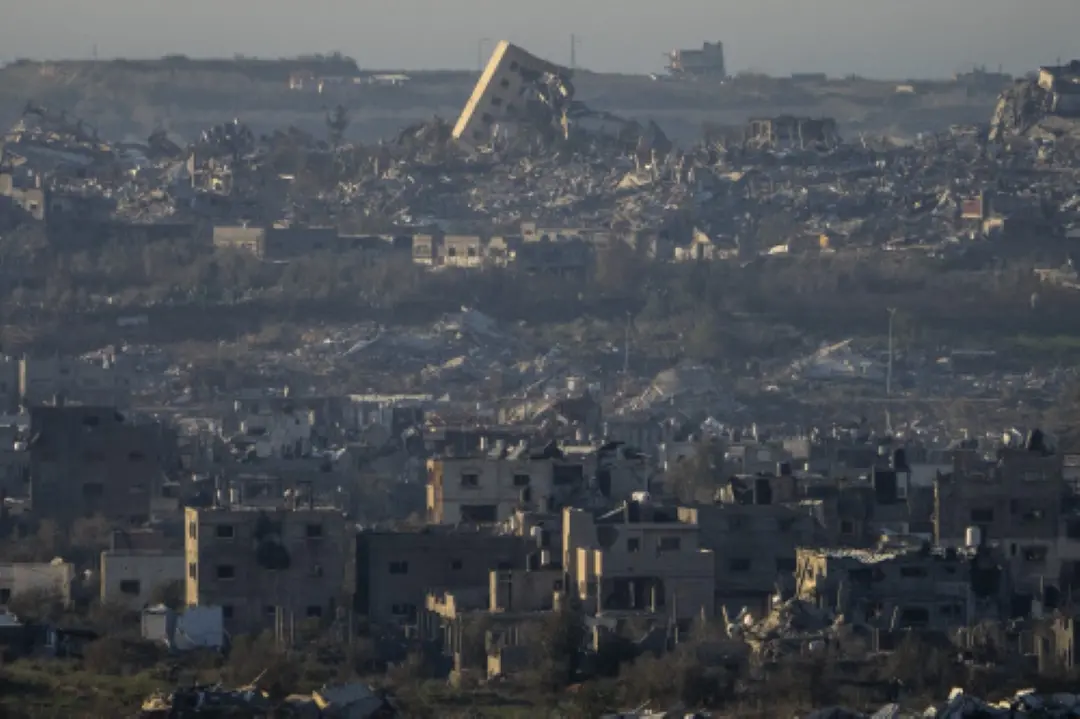 Destroyed buildings are seen inside the Gaza Strip from southern Israel | Photo: AP