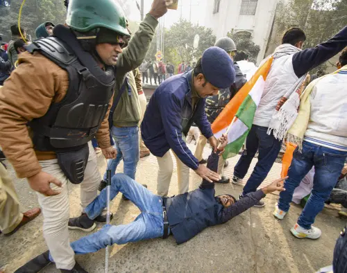 Police personnel detain a student protesting over BPSC. | File image: PTI