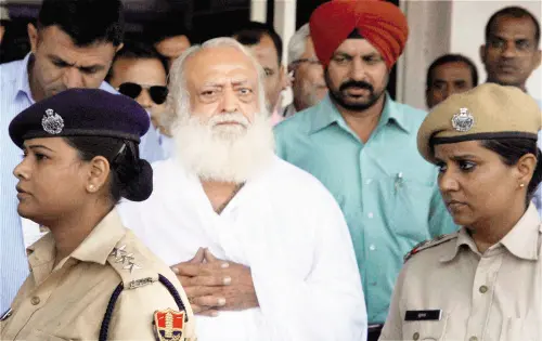 Asaram Bapu, after being arrested from his Indore ashram by Jodhpur police, arrives at Jodhpur airport. File photo | Photo: PTI