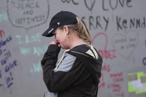 Alisa Kuhns, visiting from Santa Rosa, Calif. reacts at memorial on Bourbon Street for the victims of a deadly truck attack on New Year's Day in New Orleans, Friday, Jan. 3, 2025. | Photo: AP