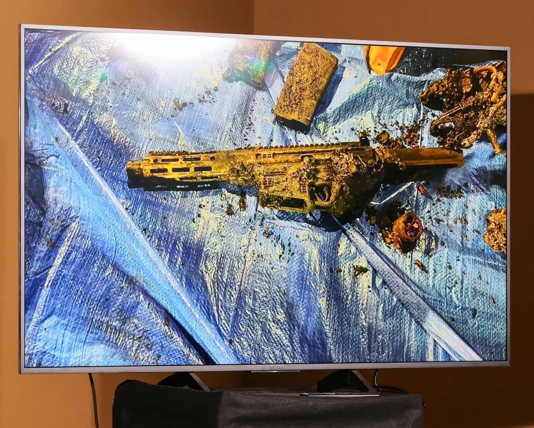 A monitor displays an image of a burned semiautomatic firearm recovered from a Tesla Cybertruck that exploded on New Year's Day in front of the entrance to the Trump International Hotel and Tower Las Vegas during a news conference at Las Vegas Metropolitan Police Department headquarters | Photo: AFP