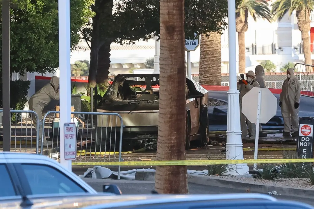 Investigators photograph a Tesla Cybertruck that exploded outside the lobby of President-elect Donald Trump's hotel