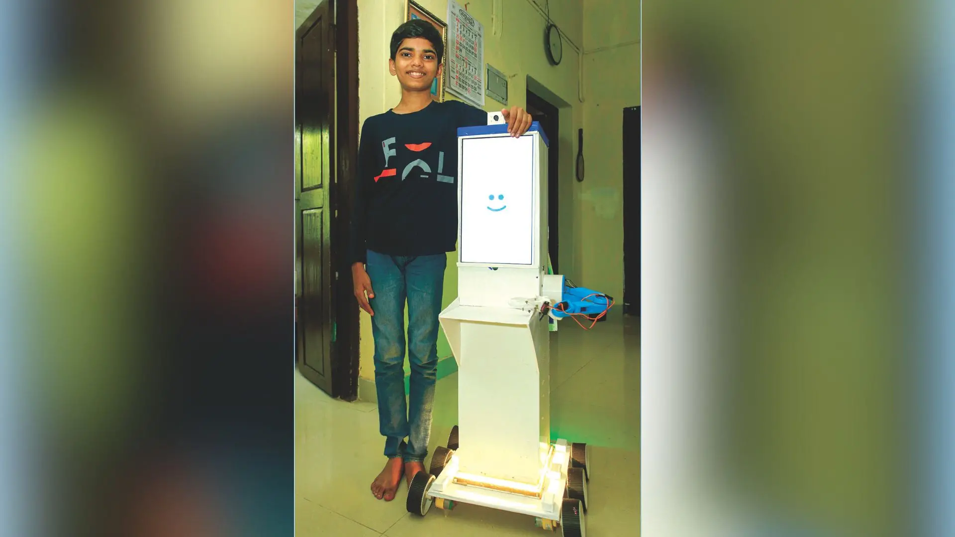 Adidev Narayan with the NARS robot he designed